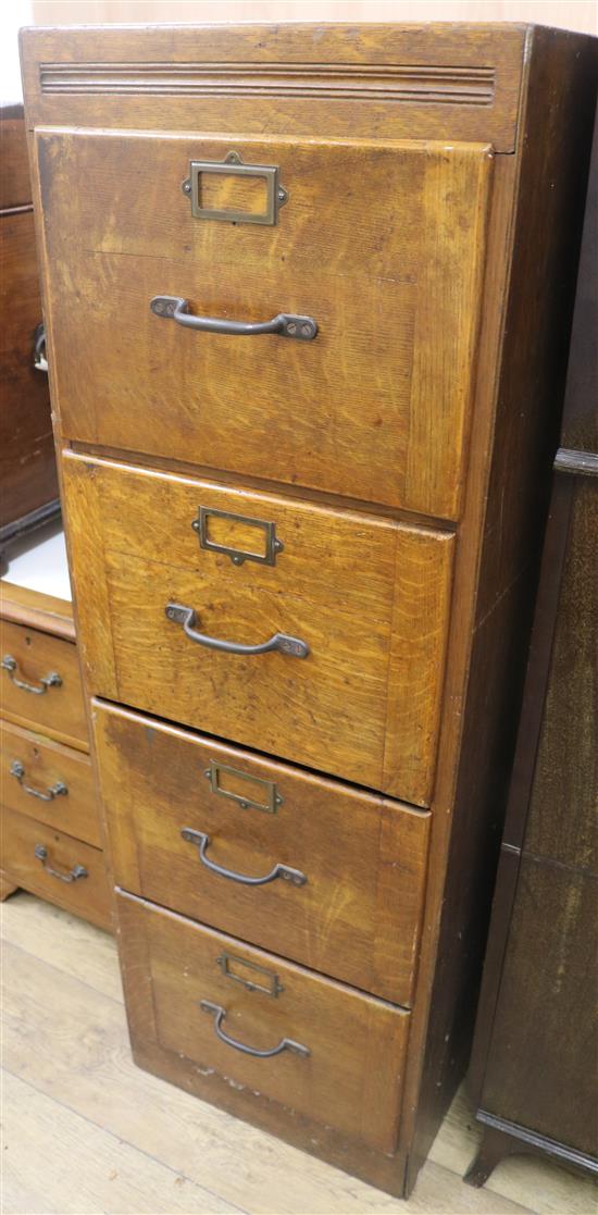 An oak four drawer filing cabinet, H.139cm
